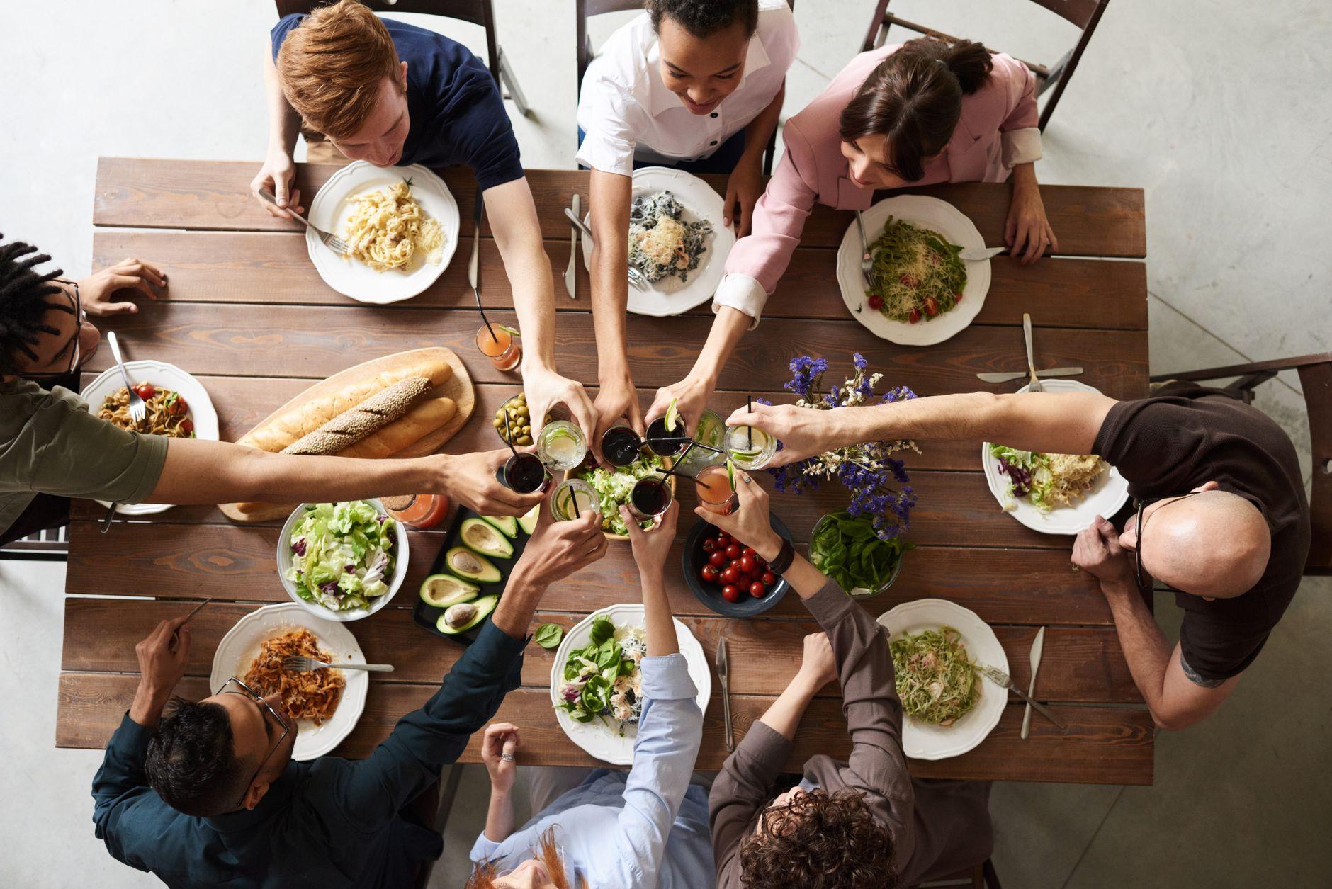 Diners' table seen from above, meals mid-service